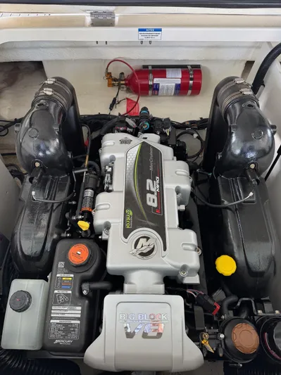  Yacht Photos Pics 2020 Sea Ray 290SDX engine compartment with MerCruiser 8.2L engine and fire extinguisher.