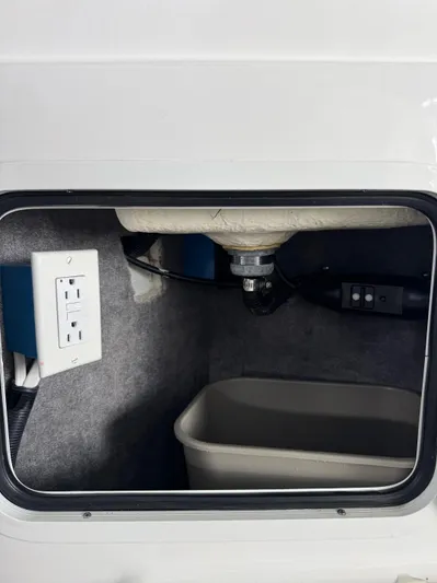  Yacht Photos Pics 2020 Sea Ray 290SDX interior storage compartment with electrical outlet and sink.