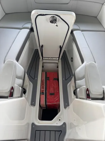  Yacht Photos Pics 2020 Sea Ray 290SDX boat storage compartment with red life jacket inside.