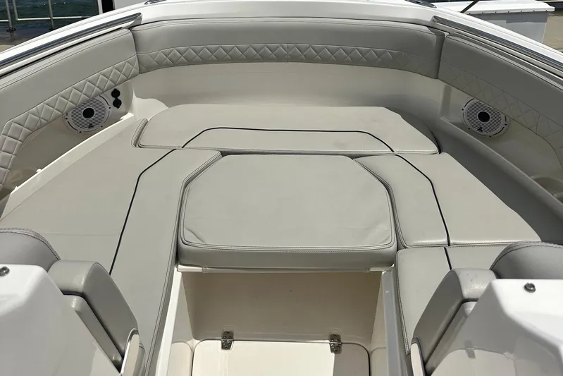 Sheminem Yacht Photos Pics 2023 Pursuit DC 295 Dual Console boat interior with cushioned seating and speakers.