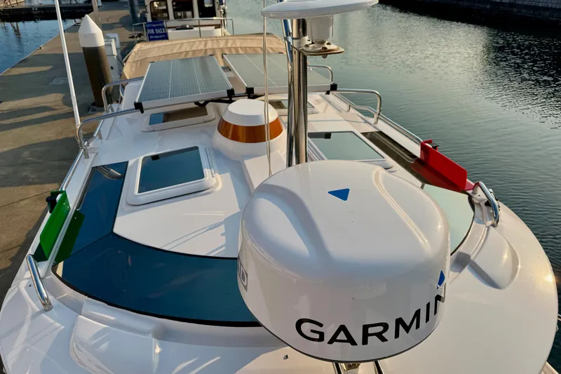 Noodles Yacht Photos Pics 2024 Ranger Tugs R-27 boat with Garmin equipment and solar panels docked at marina.