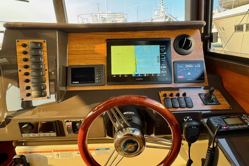 Noodles Yacht Photos Pics 2024 Ranger Tugs R-27 helm with navigation screens and controls.