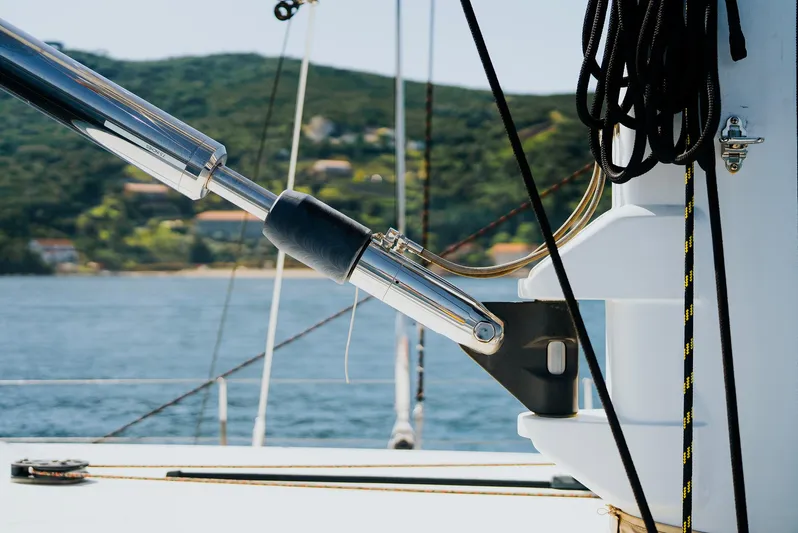 Eclipse Yacht Photos Pics Sailing yacht rigging detail on 1991 Alloy Yachts Dubois Design, with scenic coastal backdrop.