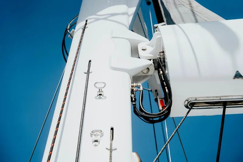 Eclipse Yacht Photos Pics Close-up of Alloy Yachts Dubois Design mast, 1991, against clear blue sky.