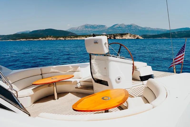 Eclipse Yacht Photos Pics Luxury yacht deck with seating, tables, and ocean view; Alloy Yachts Dubois Design, 1991.