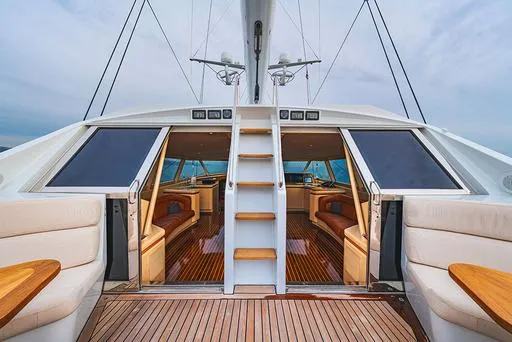 Eclipse Yacht Photos Pics Luxurious 1991 Alloy Yachts Dubois Design interior with elegant wood finishes and spacious seating.