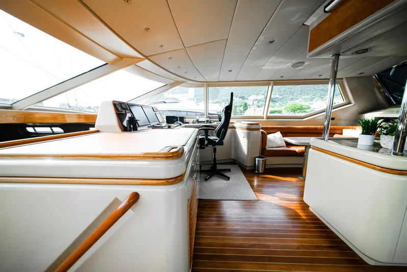 Eclipse Yacht Photos Pics Luxurious interior of 1991 Alloy Yachts Dubois Design, featuring sleek wood and modern furnishings.