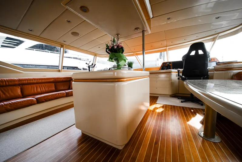 Eclipse Yacht Photos Pics Luxurious interior of 1991 Alloy Yachts Dubois Design with elegant wood flooring and seating.