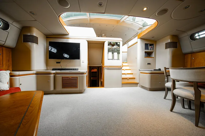 Eclipse Yacht Photos Pics Luxurious interior of 1991 Alloy Yachts Dubois Design, featuring modern furnishings and skylight.