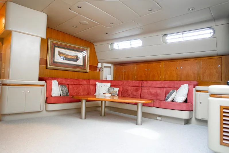 Eclipse Yacht Photos Pics Luxurious yacht interior with red seating, wooden accents, and modern design, Alloy Yachts Dubois 1991.