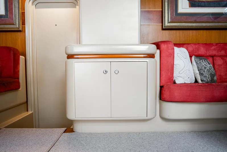 Eclipse Yacht Photos Pics Interior of 1991 Alloy Yachts Dubois Design, featuring red seating and white cabinetry.