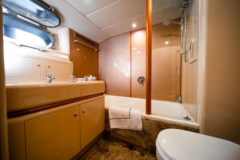 Eclipse Yacht Photos Pics Luxurious yacht bathroom with modern fixtures, featuring a bathtub and elegant design.