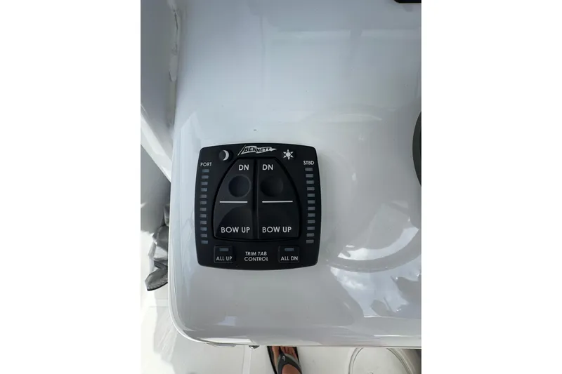  Yacht Photos Pics 2024 Sea Hunt Gamefish 27 trim tab control panel on boat dashboard.