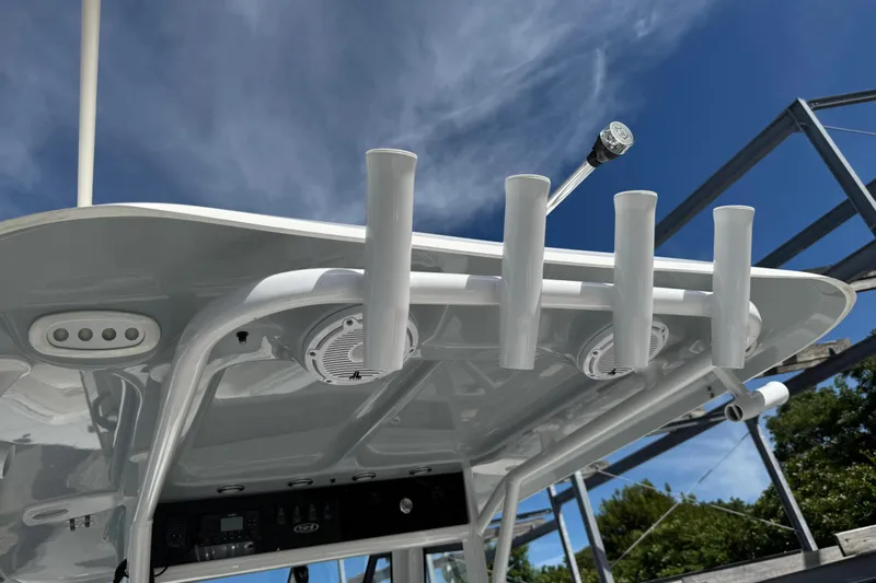  Yacht Photos Pics 2024 Sea Hunt Gamefish 27 boat with rod holders and speakers under a clear sky.