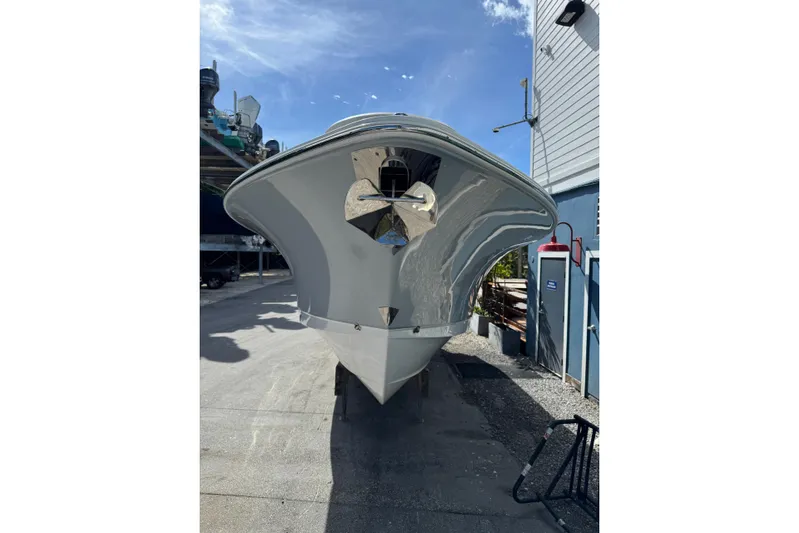  Yacht Photos Pics 2024 Sea Hunt Gamefish 27 Forward Seating boat, docked under clear blue sky.