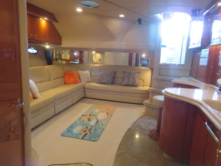  Yacht Photos Pics Luxurious interior of 2001 Sea Ray 510 Sundancer yacht with plush seating and elegant decor.