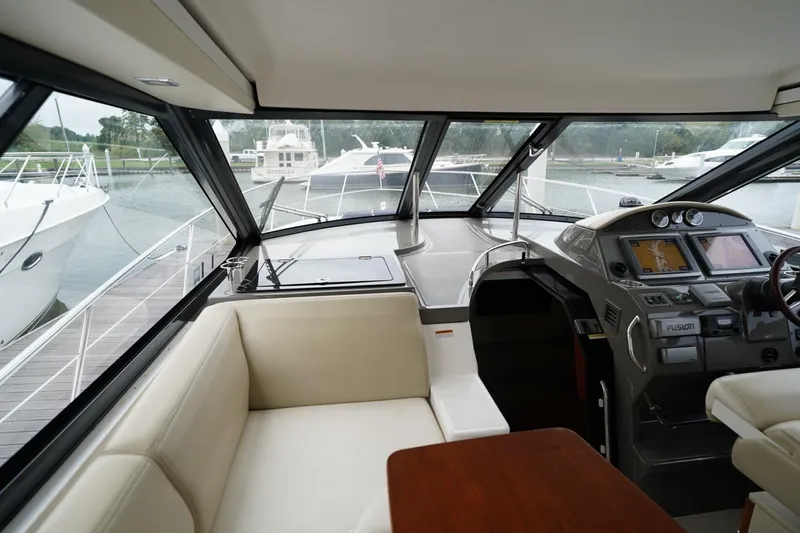  Yacht Photos Pics Interior of 2012 Regal 42 Sport Coupe yacht with helm and seating area.