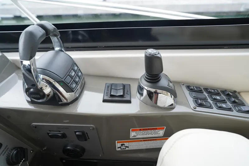  Yacht Photos Pics Control panel of a 2012 Regal 42 Sport Coupe boat with joystick and throttle.