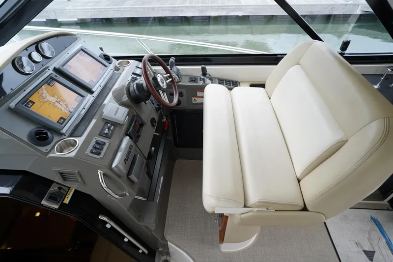  Yacht Photos Pics Helm of 2012 Regal 42 Sport Coupe with dual navigation screens and leather seating.