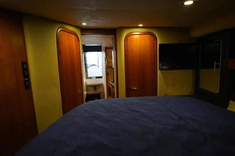  Yacht Photos Pics Interior of 2012 Regal 42 Sport Coupe yacht, featuring cozy cabin and modern amenities.