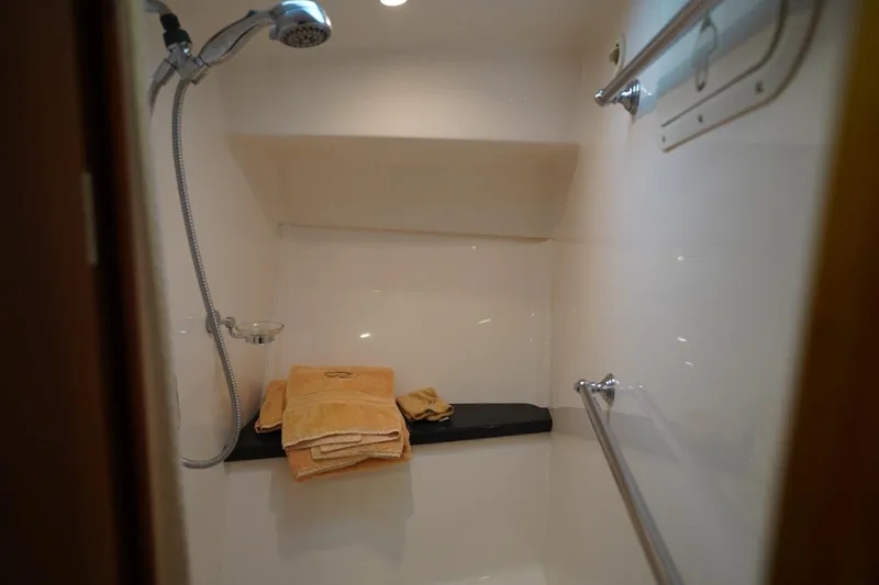  Yacht Photos Pics Shower area in 2012 Regal 42 Sport Coupe with towels and handheld showerhead.