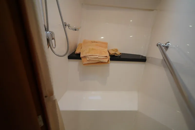  Yacht Photos Pics Shower area in 2012 Regal 42 Sport Coupe with towels and modern fixtures.