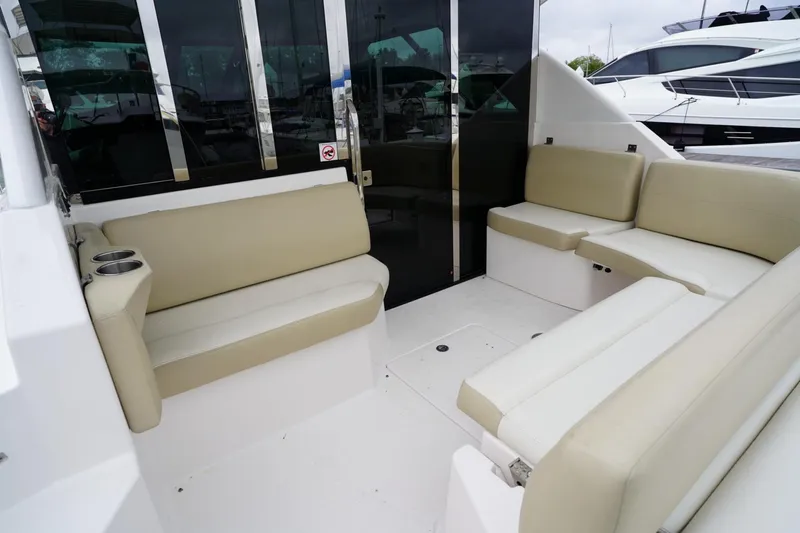  Yacht Photos Pics 2012 Regal 42 Sport Coupe interior with beige seating and glass doors.