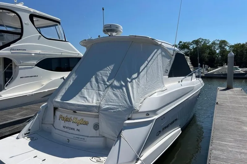  Yacht Photos Pics 2012 Regal 42 Sport Coupe docked at marina under clear blue sky.