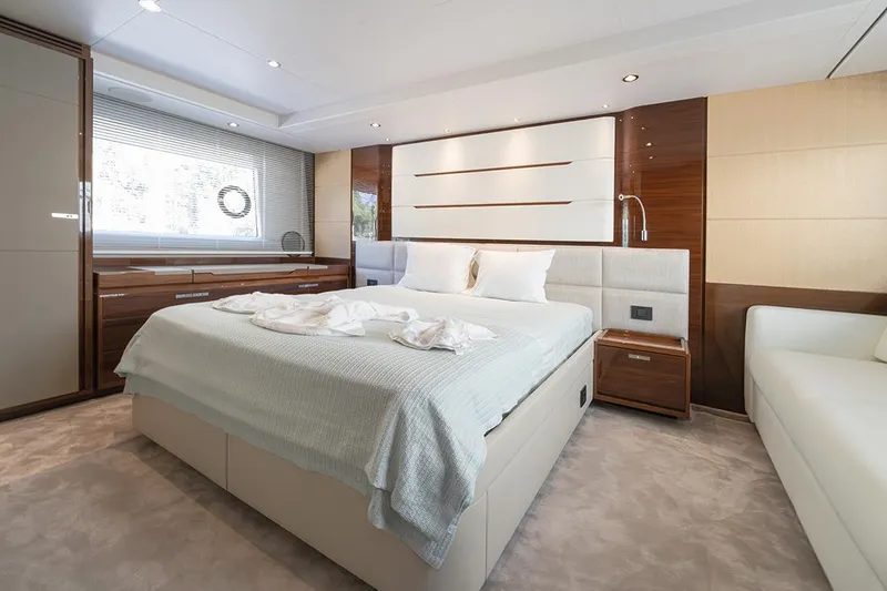 Daphne Yacht Photos Pics Luxurious bedroom interior on a 2018 Princess 68 yacht, featuring elegant design and modern furnishings.
