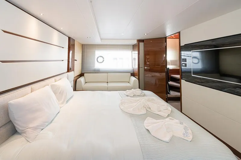 Daphne Yacht Photos Pics Luxurious bedroom interior of 2018 Princess 68 yacht with elegant furnishings and modern design.