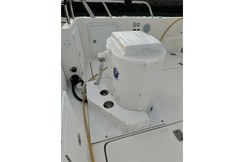  Yacht Photos Pics 2019 Aspen C107 boat deck with storage compartment and hoses.