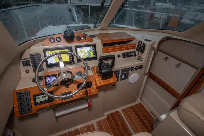  Yacht Photos Pics Cockpit of 2019 Aspen C107 boat with navigation screens and steering wheel.