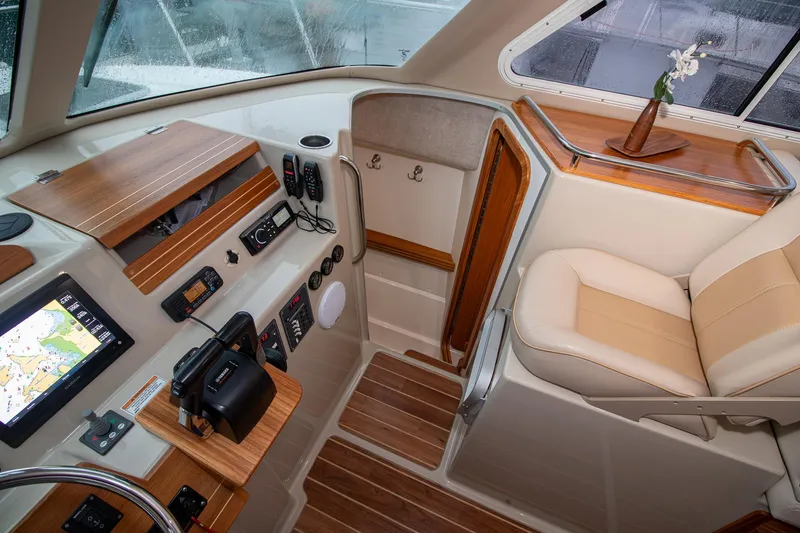  Yacht Photos Pics Cockpit of 2019 Aspen C107 boat with navigation controls and seating.