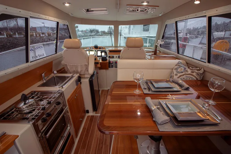  Yacht Photos Pics Interior of 2019 Aspen C107 yacht with dining area and kitchen amenities.