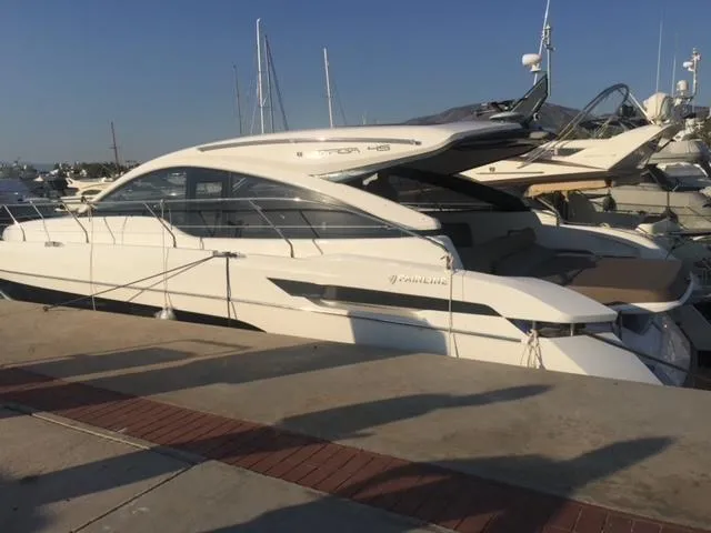  Yacht Photos Pics 2021 Fairline Targa 45 Open yacht docked at marina under clear blue sky.
