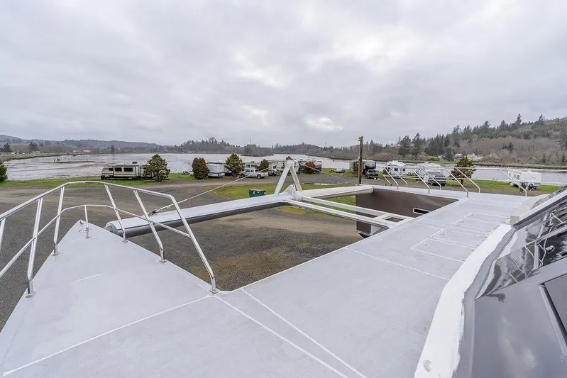 Mai Cat Yacht Photos Pics 2025 Catamaran Bloomfield 86 Motorsailor on land, showcasing deck and surrounding landscape.