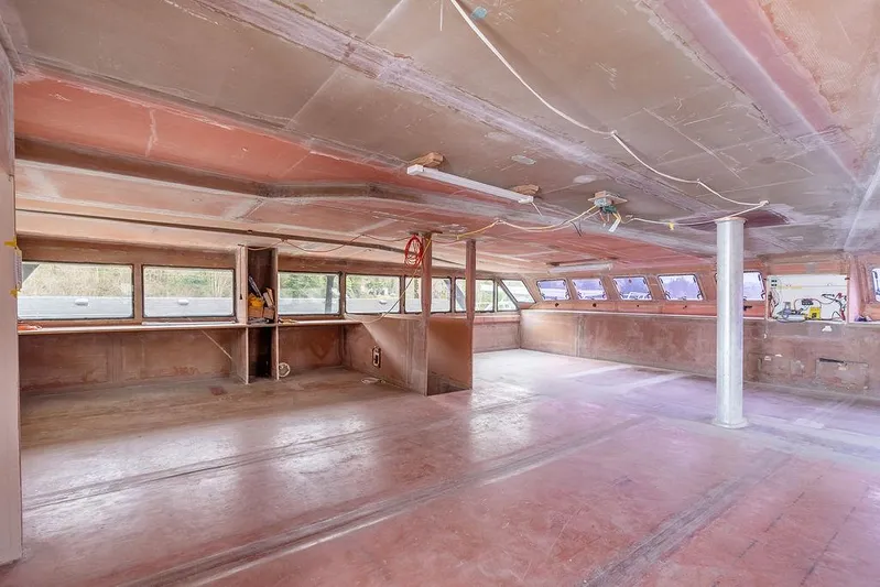 Mai Cat Yacht Photos Pics Interior of 2025 Catamaran Bloomfield 86 Motorsailor under construction, spacious and unfinished.