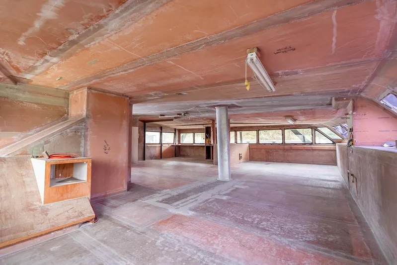 Mai Cat Yacht Photos Pics Spacious interior of 2025 Catamaran Bloomfield 86 Motorsailor, featuring unfinished wooden surfaces.