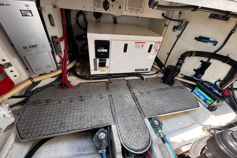 Love Shact Yacht Photos Pics Engine compartment of a 2012 Formula 37 PC boat with Kohler generator and battery.