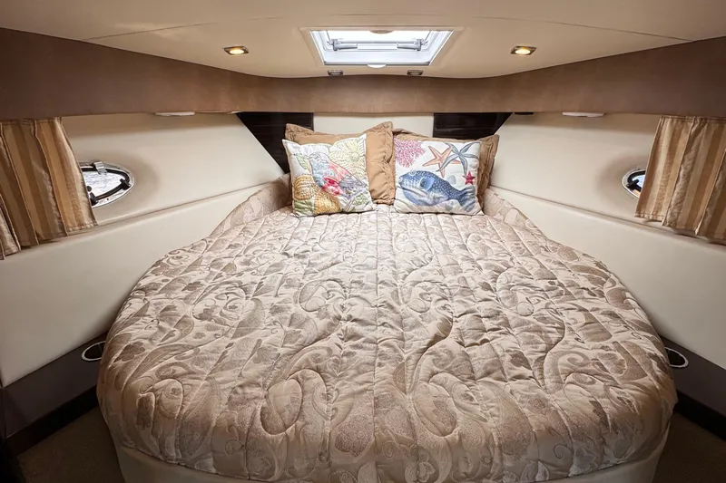 Love Shact Yacht Photos Pics Luxurious cabin interior of 2012 Formula 37 PC yacht with elegant bedding and decorative pillows.