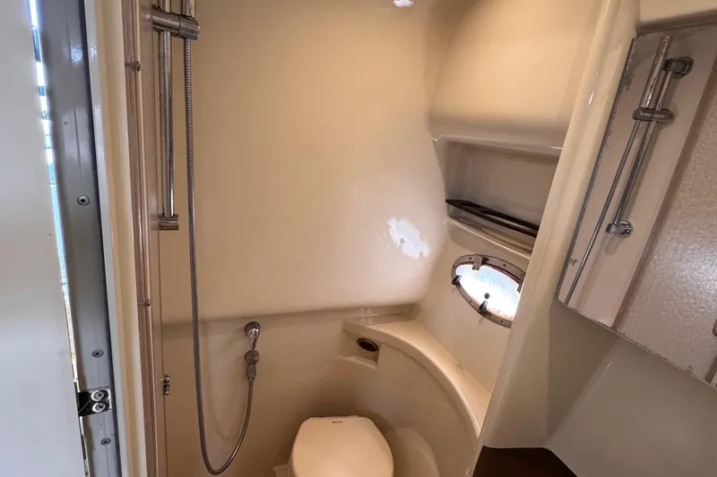 Love Shact Yacht Photos Pics Bathroom interior of 2012 Formula 37 PC yacht with shower and porthole.