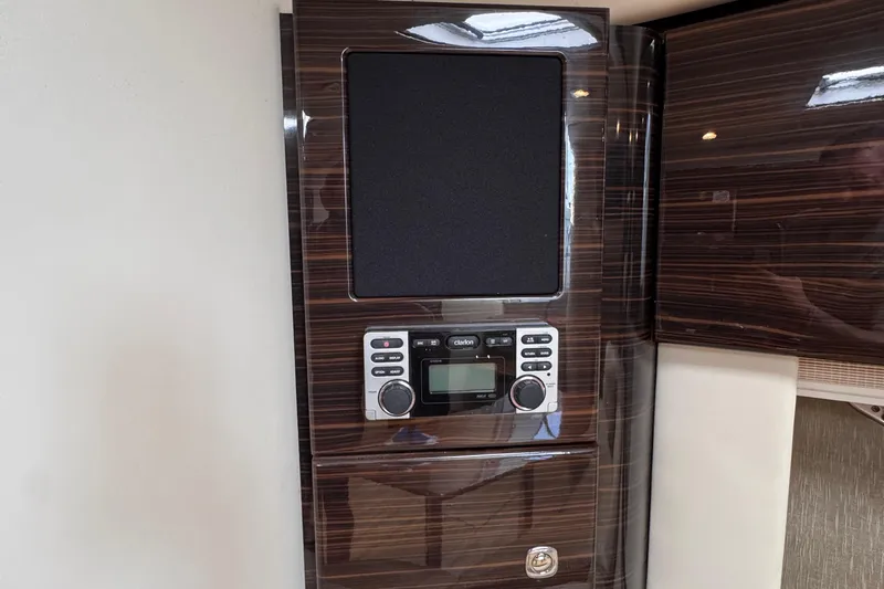 Love Shact Yacht Photos Pics 2012 Formula 37 PC interior with wood paneling and audio system.