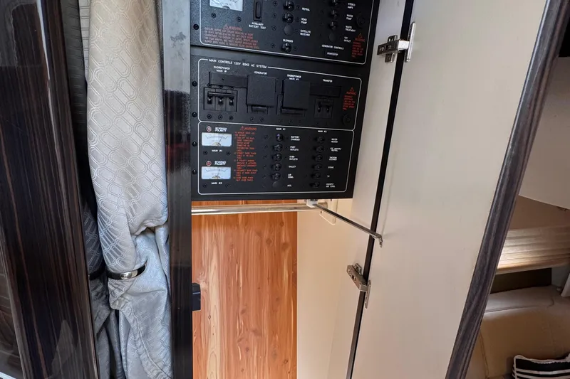 Love Shact Yacht Photos Pics Control panel inside a 2012 Formula 37 PC boat, featuring various switches and indicators.