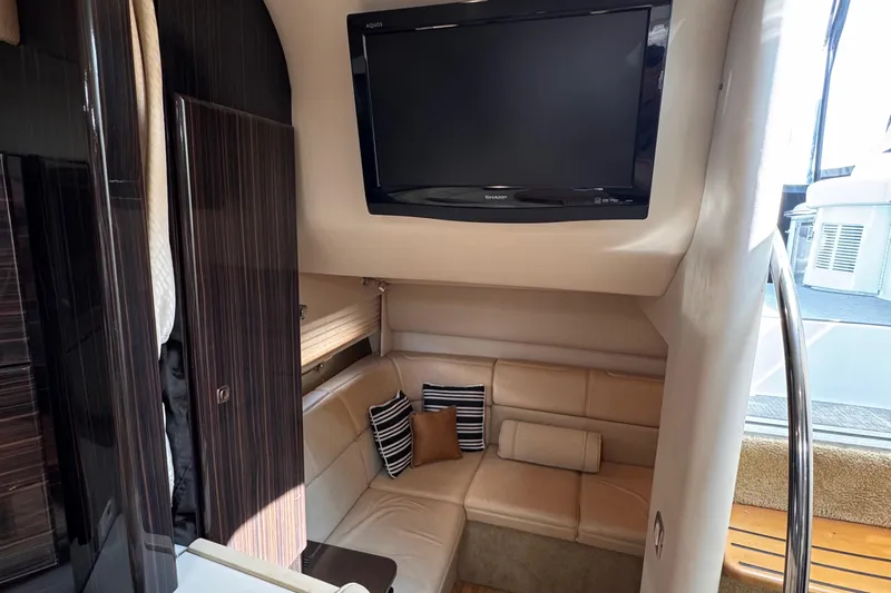 Love Shact Yacht Photos Pics Luxurious interior of 2012 Formula 37 PC yacht with TV and cozy seating area.