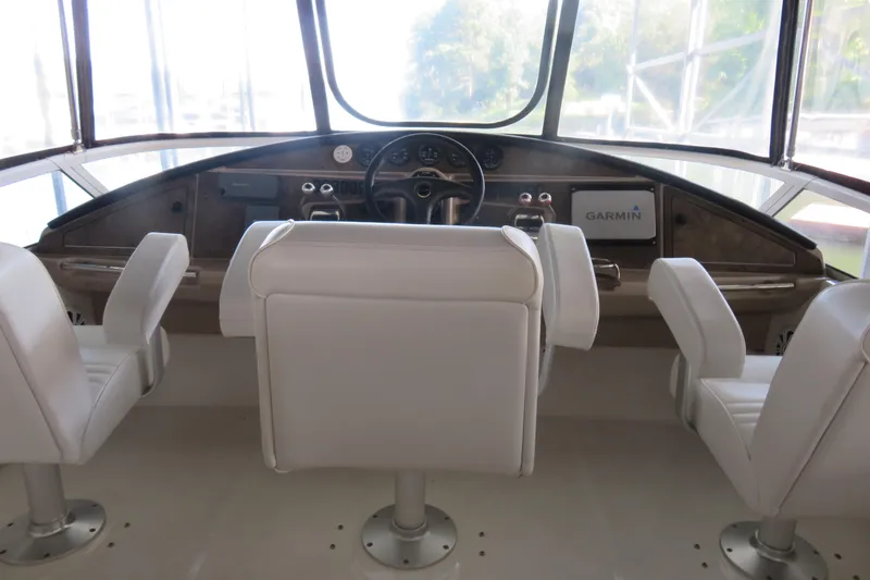 38 Special Yacht Photos Pics 2006 Carver 38 Super Sport helm with white seats and Garmin navigation system.