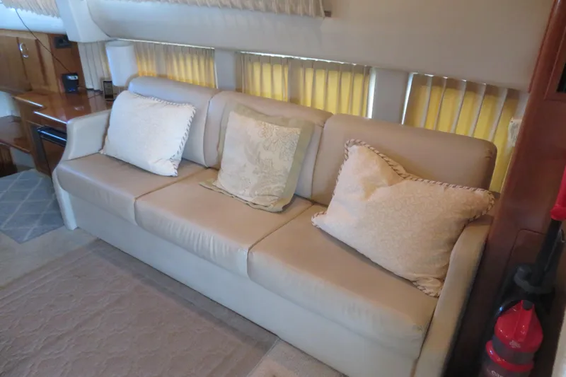 38 Special Yacht Photos Pics Luxurious interior of 2006 Carver 38 Super Sport yacht with beige sofa and cushions.