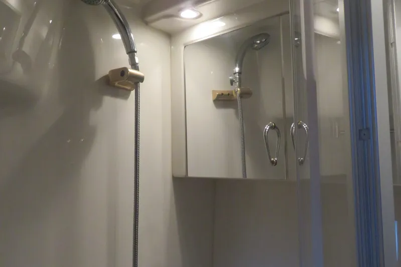 38 Special Yacht Photos Pics Shower area in 2006 Carver 38 Super Sport yacht with mirrored cabinets.