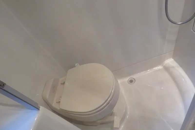 38 Special Yacht Photos Pics Compact bathroom in 2006 Carver 38 Super Sport yacht with toilet and shower.