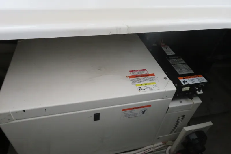 38 Special Yacht Photos Pics Engine compartment of a 2006 Carver 38 Super Sport boat with warning labels.