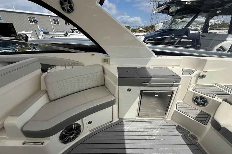  Yacht Photos Pics 2020 Sea Ray SLX 350 Outboard interior with seating, speakers, and kitchenette.